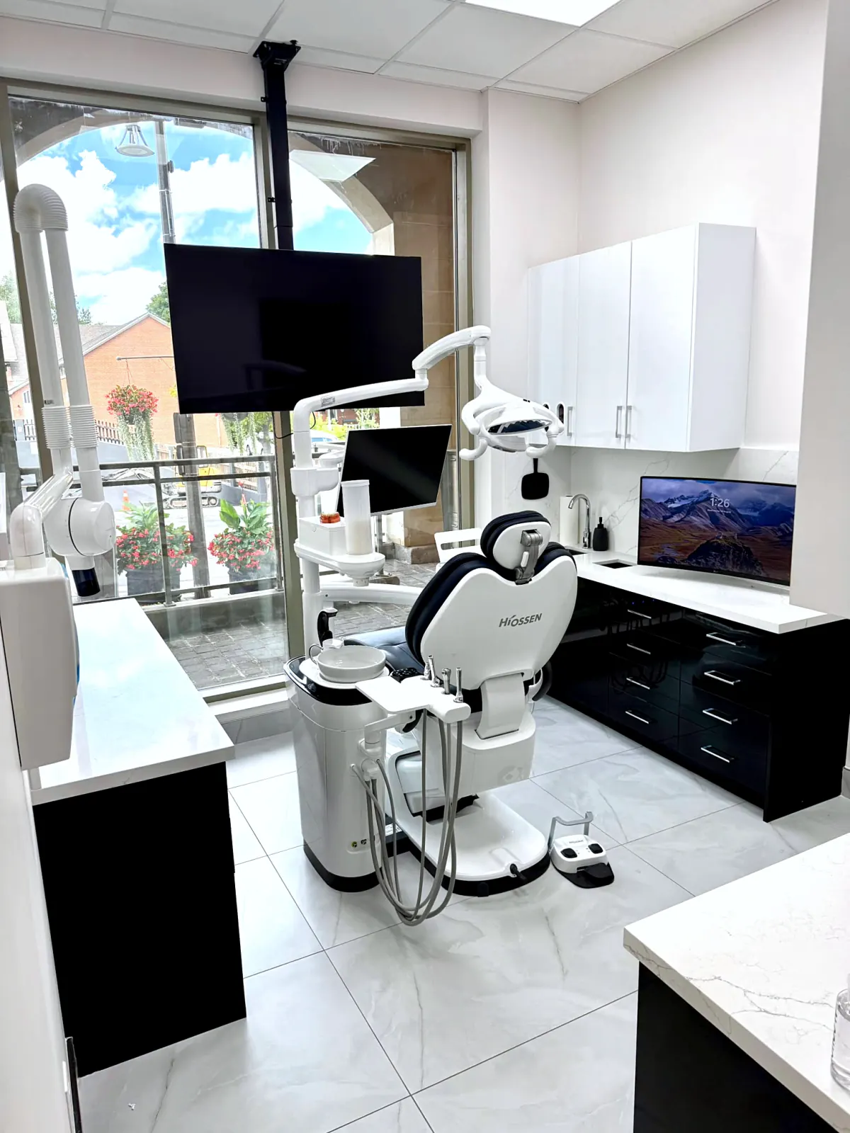 Dental chair with chairside digital screens at Woodbridge Dental Arts